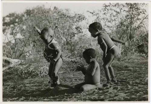 "Children playing curing dance": /Gaishay (son of Di!ai and "Gao Medicine"), Bau (daughter of "Crooked /Qui" and //Khuga), and "Little ≠Gao" (son of "/Qui Navel" and //Kushay) dancing a medicine dance (print is a cropped image)