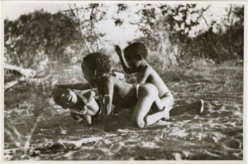 "Children playing curing dance": /Gaishay (son of Di!ai and "Gao Medicine"), Bau (daughter of "Crooked /Qui" and //Khuga), and "Little ≠Gao" (son of "/Qui Navel" and //Kushay) dancing a medicine dance, with /Gaishay having fallen in trance (print is a cropped image)