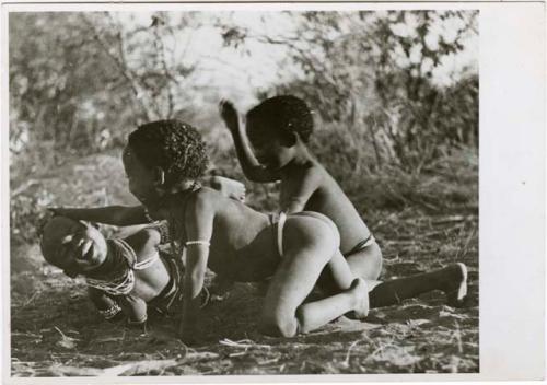 "Children playing curing dance": /Gaishay (son of Di!ai and "Gao Medicine"), Bau (daughter of "Crooked /Qui" and //Khuga), and "Little ≠Gao" (son of "/Qui Navel" and //Kushay) dancing a medicine dance, with /Gaishay having fallen in trance (print is a cropped image)