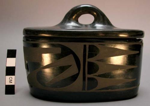 Black-on-black covered oval box