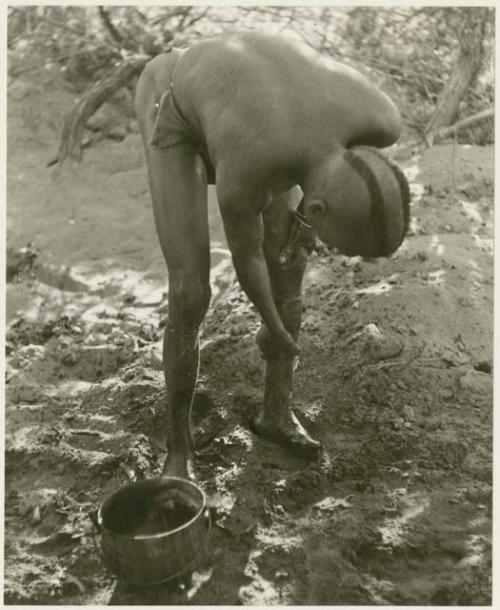 "Visiting man" washing his leg (print is a cropped image)