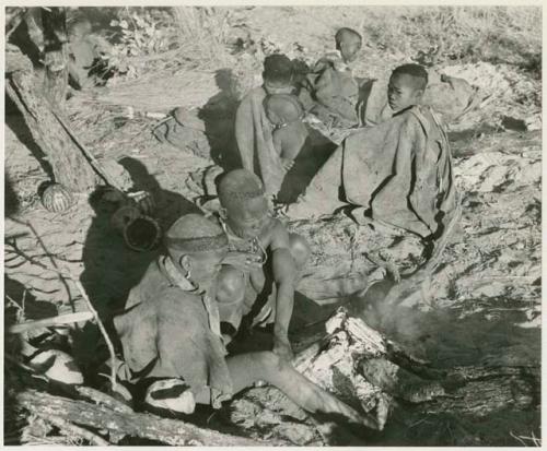 Group of visitors presumably cooking in their werft (print is a cropped image)