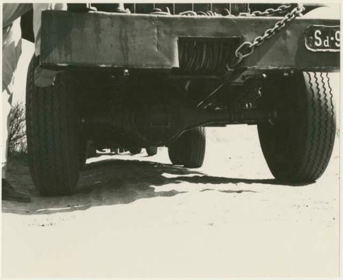 Close-up of tying couple of one of the expedition's trucks (print is a cropped image)