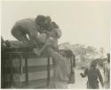 William Donnellan and Casper Kruger lifting "/Qui Hunter" into the truck (print is a cropped image)