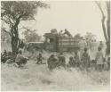 The expedition and a group of Ju/'hoansi gathered around the truck (print is a cropped image)