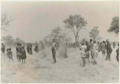 Ju/'hoansi and expedition members waving goodbye (print is a cropped image)