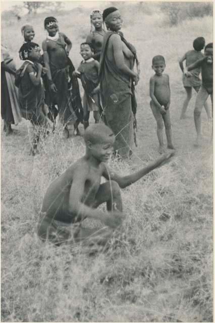 Women, children, and "Lame ≠Gao" playing a game (print is a cropped image)