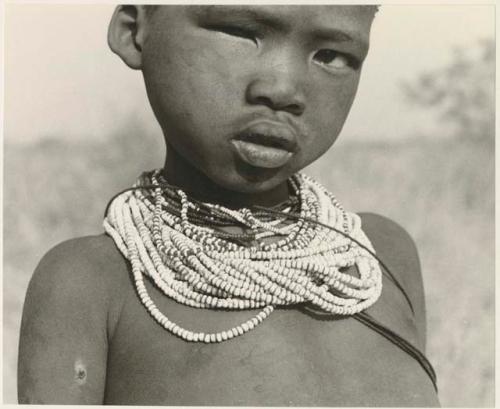 Headshot of /Gaishay (son of "Gao Medicine") wearing beaded necklaces (print is a cropped image)