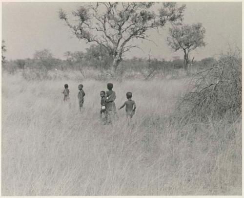 Children walking in the grass (print is a cropped image)