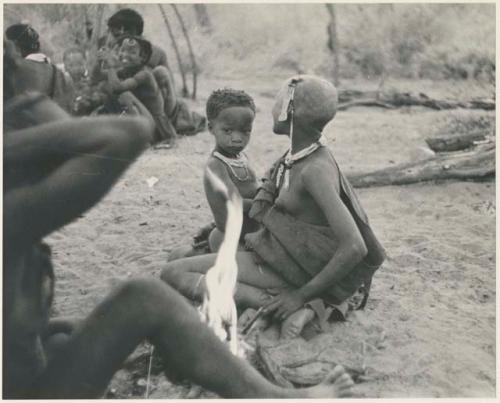 !Ungka Norna sitting on the lap of a visiting girl (print is a cropped image)