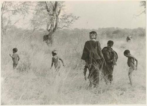 Girls and other children, seen from the back (print is a cropped image)