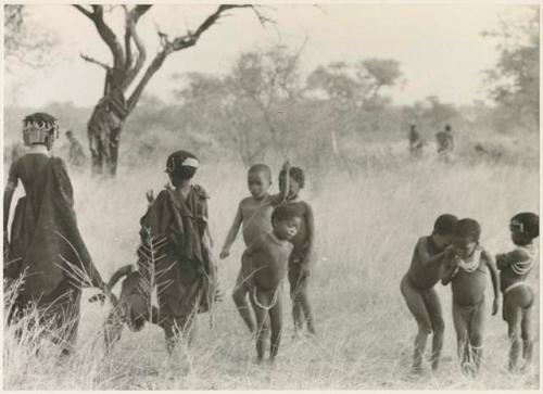 Group of girls and other children dancing (print is a cropped image)