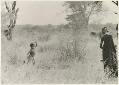 Boy running across the veld (print is a cropped image)