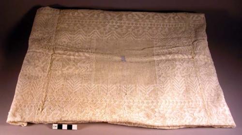 Huipil material, uncut, white. white deign woven in. 112 x 99 cm.