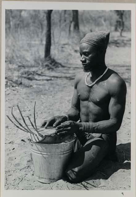 Bela playing a //guashi on a tin bucket



