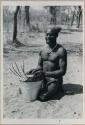 Bela playing a //guashi on a tin bucket




