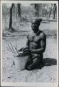 Bela playing a //guashi on a tin bucket




