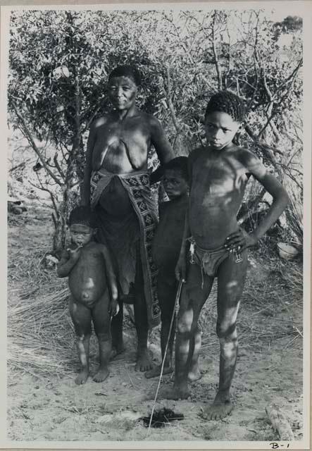 Full-body portrait of a woman and three children
