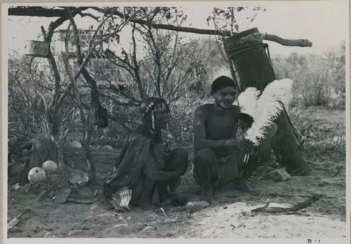 "/Gao Overalls" and woman sitting
