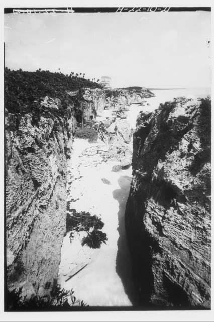 Castillo - looking north along cleft from Temple 54.