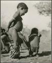 "Children playing curing dance": "Little ≠Gao" (son of "/Qui Navel") dancing with /Gaishay (son of "Gao Medicine" and Di!ai) (print is a cropped image)