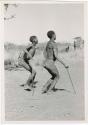 "Daytime Dance at Gautscha 1952, Early in the Dance, approach": Child dancing beside her father (print is a cropped image)