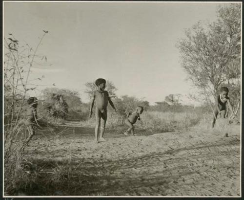 "Stick Throwing Game": Boys playing Bah n≠aq’u (the stick throwing game) (print is a cropped image)