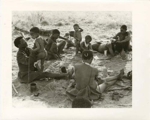 "Photos of Children": ≠Toma bounces !Ungka Norna on his lap (print is a cropped image)