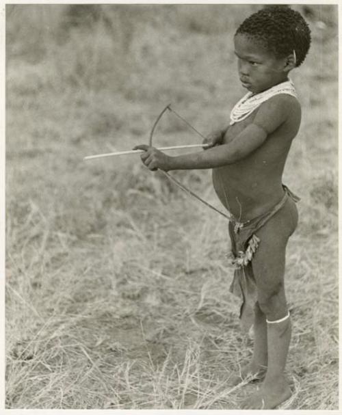 /Gaishay ("Gao Medicine" and Di!ai's son) with a toy bow and arrow, pulling back the string to release an arrow (print is a cropped image)