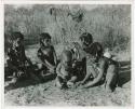 "Norna with groups": "Little N!ai" (left) and three unidentified girls sitting with !Ungka Norna (center) (print is a cropped image)