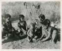 "Norna with groups": "Little N!ai" (left) and three unidentified girls sitting with !Ungka Norna (center) (print is a cropped image)