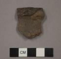 Ceramic, earthenware rim sherd, incised rim, undecorated body, shell-tempered