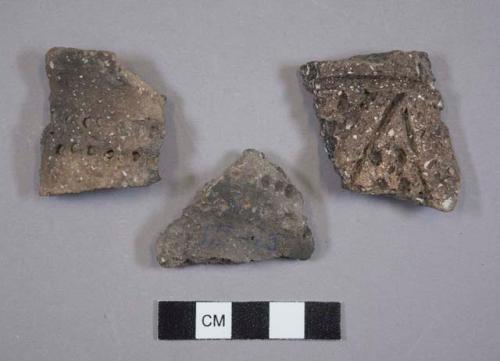 Ceramic, earthenware body sherds, one incised and punctate, one punctate, shell-tempered; ceramic, earthenware rim sherd, incised rim, punctate body, shell-tempered