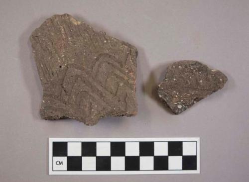 Ceramic, earthenware body sherds, cord-impressed and incised, shell-tempered; two sherds crossmend