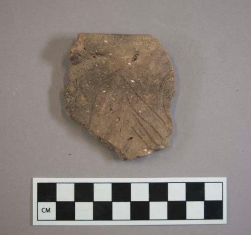 Ceramic, earthenware rim sherd, incised, shell-tempered