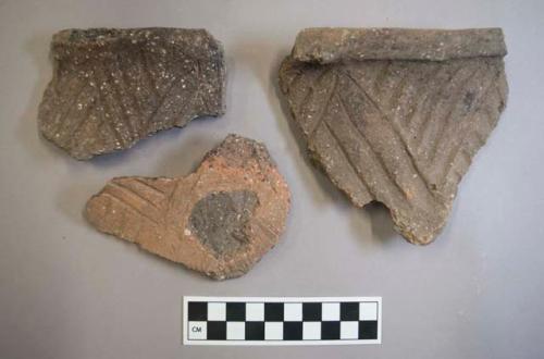 Ceramic, earthenware rim and body sherds, incised, one incised and cord-impressed, two with missing handles, shell-tempered