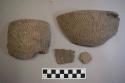 Ceramic, earthenware rim and body sherds, one with lug, cord-impressed, shell-tempered; two rim sherds crossmend