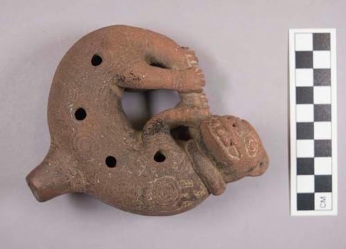 Ocarina in form of reclining jaguar or sloth