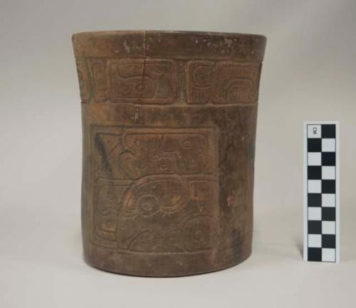 Burnished brownware vessel with incised decoration