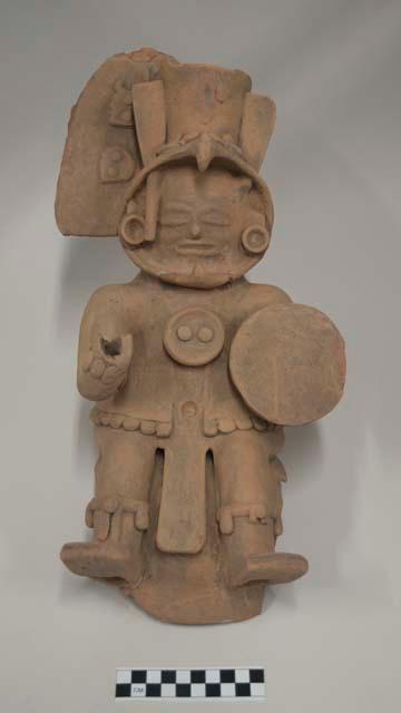 Partial figure of a warrior with eagle headdress