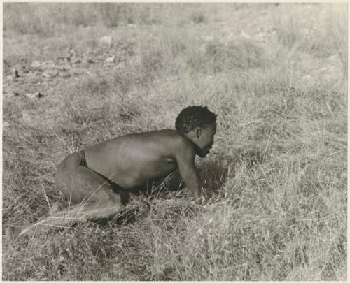 "Crooked /Qui" crawling, holding bow and arrow (print is a cropped image)