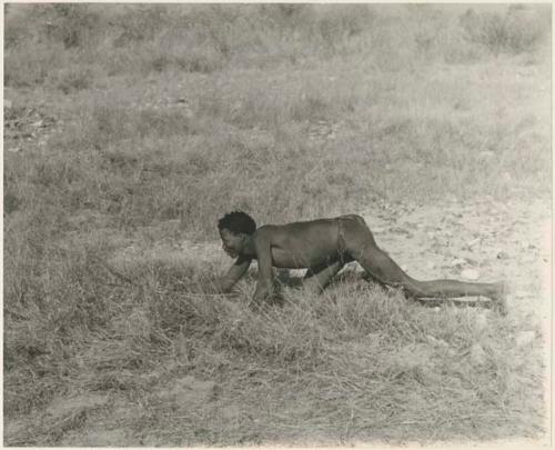 "Crooked /Qui" crawling, holding bow and arrow (print is a cropped image)