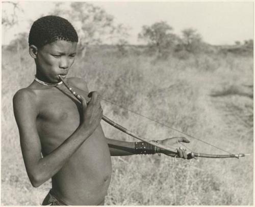 !Naishi (brother of /Goishay) playing a musical bow (print is a cropped image)