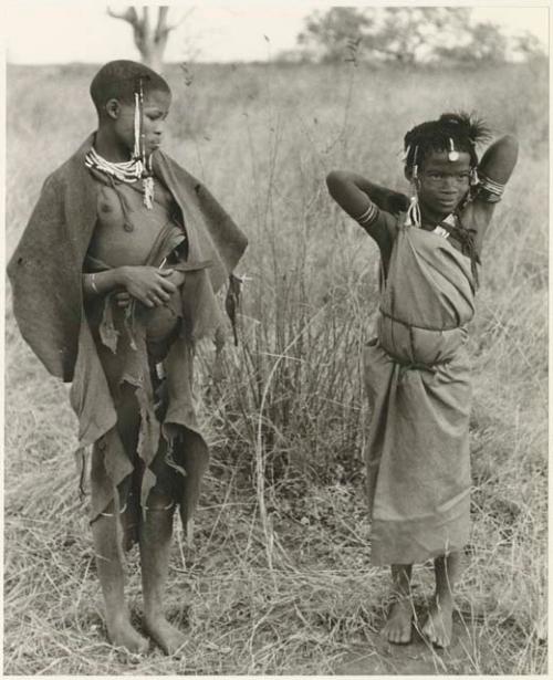 "Visiting girl" and a younger girl standing, with a cloth wrapped around herself as a garment (print is a cropped image)