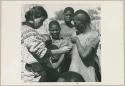 Woman having her skin color documented by Deborah Marshall (print is a cropped image)