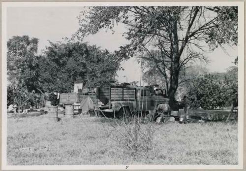 Expedition trucks and encampment on C. J. Mathias's land (print is a cropped image)