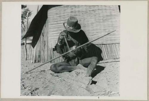 Kafuro playing the hunting bow, braced, with calabash (print is a cropped image)