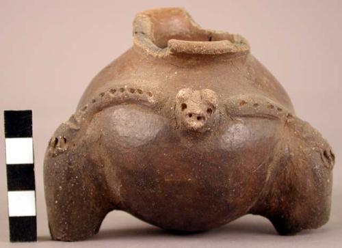 Fragmentary brown tripod pottery vessel