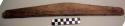 Wooden stick, possibly a kayak brace