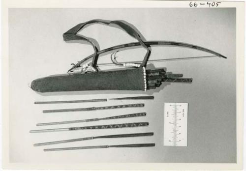 [No folder title]: Bow, quiver and arrows, with ruler for measurement